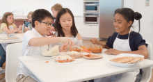 Kids in classroom learning about healthy food and the nutrition information they need to build life-long healthy habits